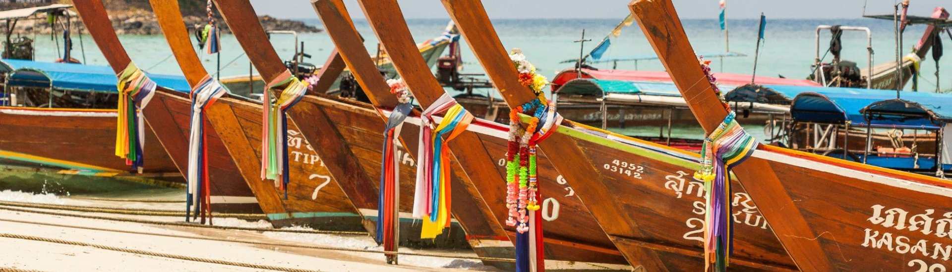 photo of Thai boats on a beach