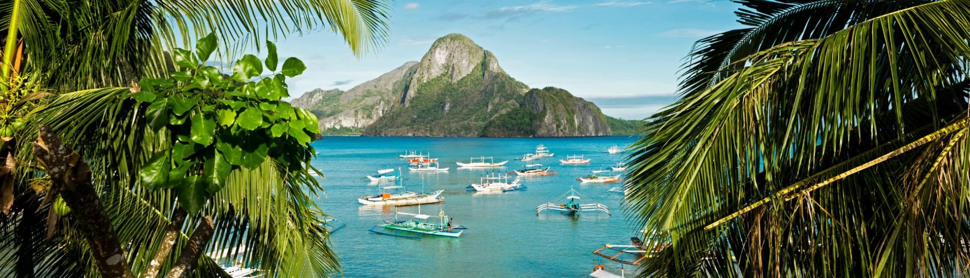 Asian sea with boats and mountain
