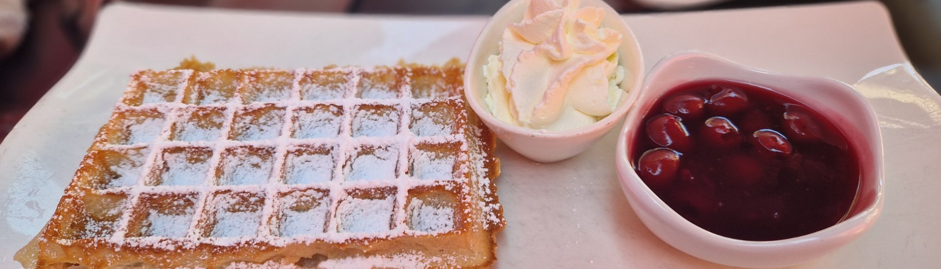 Belgium waffle with cream and cherries