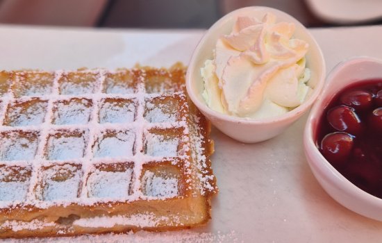 Belgium waffle with cream and cherries
